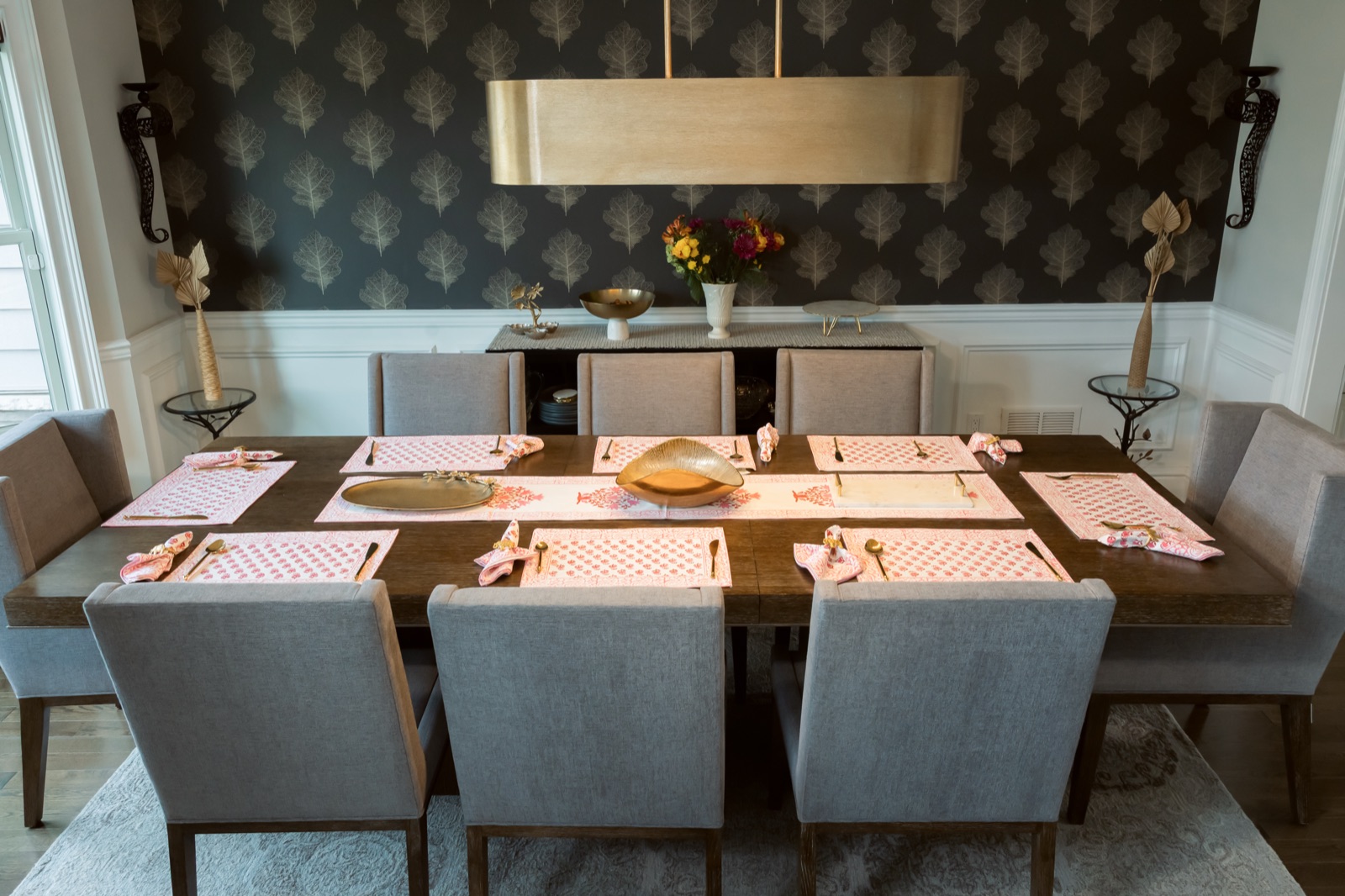 Dining table set with pink block-print mats, runner and napkins